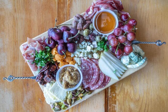 A charcuterie board will be one of the food items available at the bar.