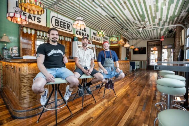 Left to right; Conner Johnson, Beverage Director, Jeff Walstehhon, Active Owner, and Joshua Palmer, Chef, are seen at the bar.