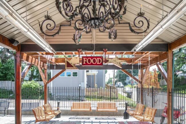 An outdoor space feature front porch swings.